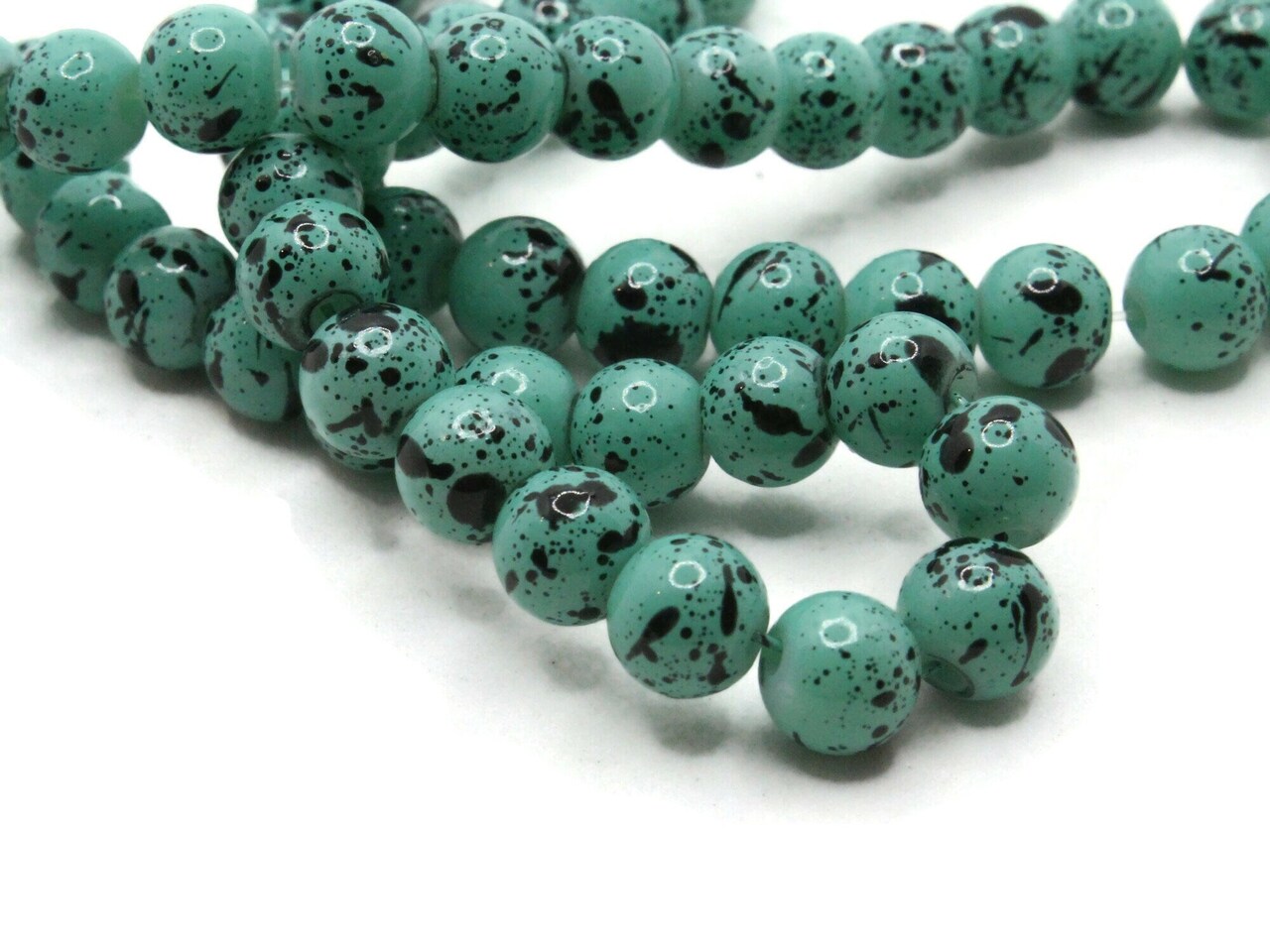 68 6mm Turquoise and Black Splatter Paint Smooth Round Glass Beads